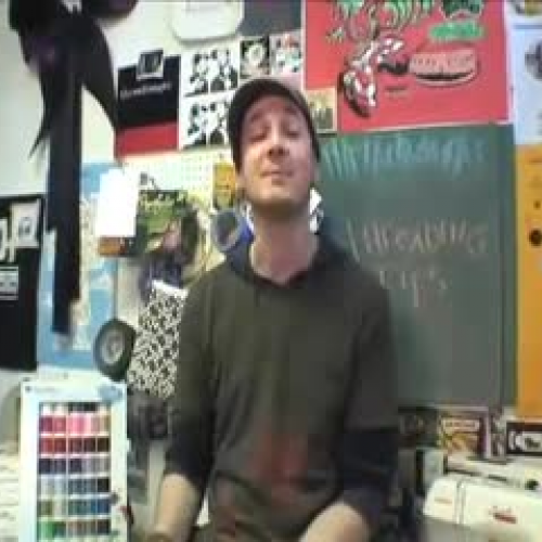 Thread a sewing needle