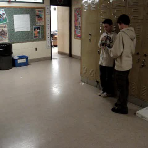 2 students with motion sensor and graphing ca