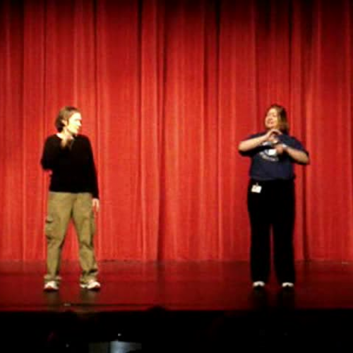 Mrs Bell and Mrs Thompson sign a song in ASL