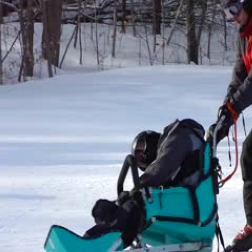 Brothers skiing together I