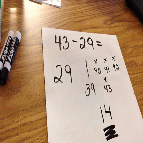 subtraction by counting on with base ten pictures