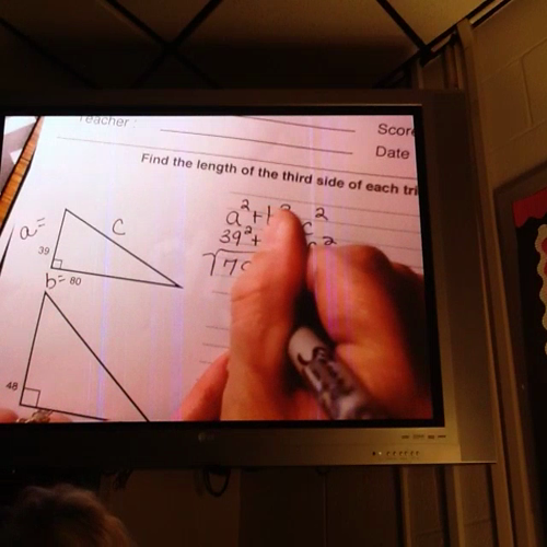 Mrs. Davis showing how to find the hypotenuse using Pythagorean Theorem