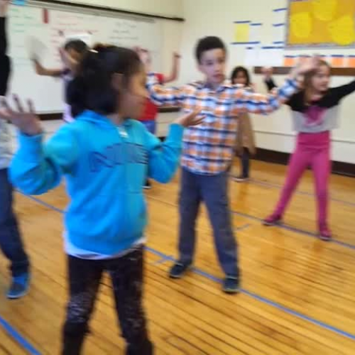 1st grade does a dance about Spontaneous Dance and Planned Dance