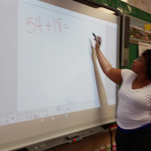 Using a place value chart and disks